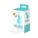 A turquoise box containing a product called "VeDO Suki - Turquoise Air Suction Clit Stimulator" by VeDO is shown. The box highlights features such as silky-smooth silicone, rechargeable capabilities, and 10 vibrating suction modes with 6 intensity levels. The product image on the box shows a compact, turquoise device.