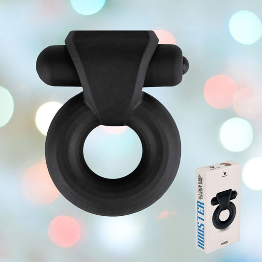 A sleek black cock ring with a cylindrical attachment is displayed against a soft blurred background featuring light circles. In the corner, a white box showcases the product's image and highlights "Velv'Or Rooster Travis Hard Silicone Vibrating Bullet Cock Ring," emphasizing its premium silicone design from Velv'Or. 1080