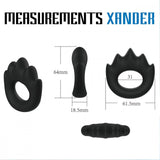 Introducing the Velv'Or Rooster Xander Spiky Soft Silicone Cock Ring by Velv'Or, featuring black silicone objects in various shapes and sizes. One item boasts a spiked cock ring design for a robust erection, another is elongated, and one is cylindrical. Dimensions are indicated alongside, showing lengths and diameters in millimeters.
