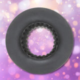 Black ELI Vibelite 4-inch Textured Liquid Silicone Masturbation Stroker, a circular device with a ridged, nubby interior.