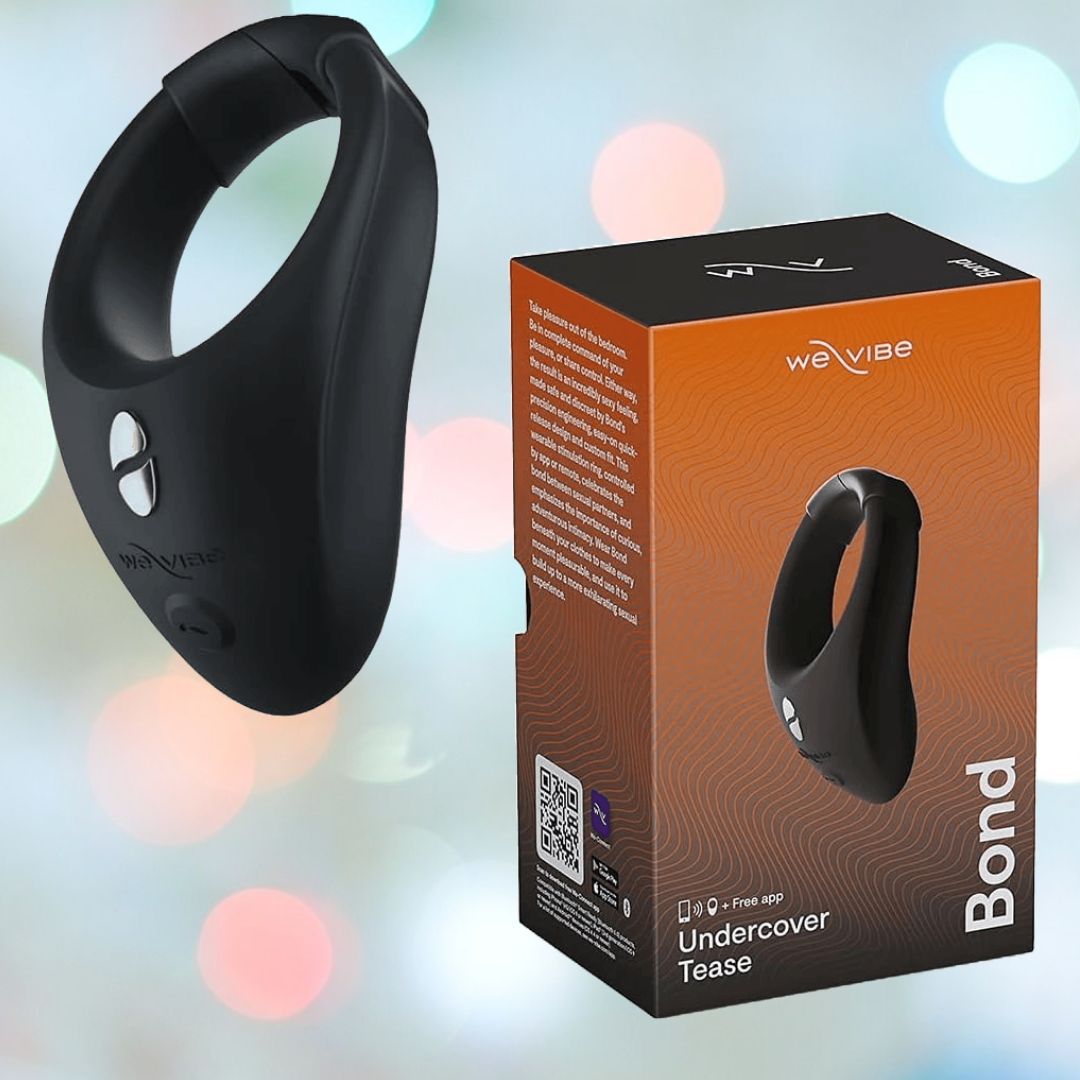 A black silicone wearable stimulation ring is shown beside its orange and black box packaging. The device, named "We-Vibe Bond App Controlled Vibrating Cock Ring," showcases a sleek, oval design with a button. The packaging highlights product details and includes the text "Undercover Tease" and a QR code.