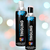 Two bottles of Wet Extra Sensations Tingling Water/Silicone Blend Based Lubricant by Wet (8 fl oz & 4 fl oz) show black labels with blue-white accents on a pastel bokeh background. The hybrid formula includes cooling peppermint extract.