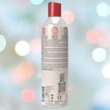 A bottle of Wet "Tropical Explosion" Warming Lubricant 🍍 with a red cap and detailed text on the back label, showcased against a blurred background of colorful lights.