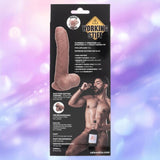 The image features packaging for the CalExotics "Working Stiff The Gyrating Bartender" waterproof vibrator, displaying product features and a shirtless man holding a bottle against a soft purple bokeh background.