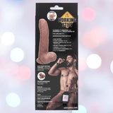 The "Working Stiff The Gyrating Bartender" by CalExotics comes in packaging featuring a bearded man in underwear with the toy. The box highlights 10 speeds, dual motors, suction base, USB rechargeability, and waterproof design.