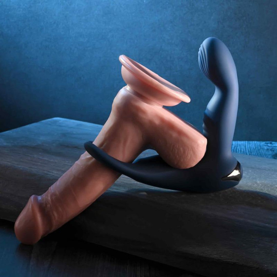 The Zero Tolerance By All Means Remote Control Prostate Vibrator, a prosthetic adult toy with a suction base, is complemented by its curved, dark-colored design featuring a come-hither motion, beautifully showcased against a dark blue background on a wooden surface.