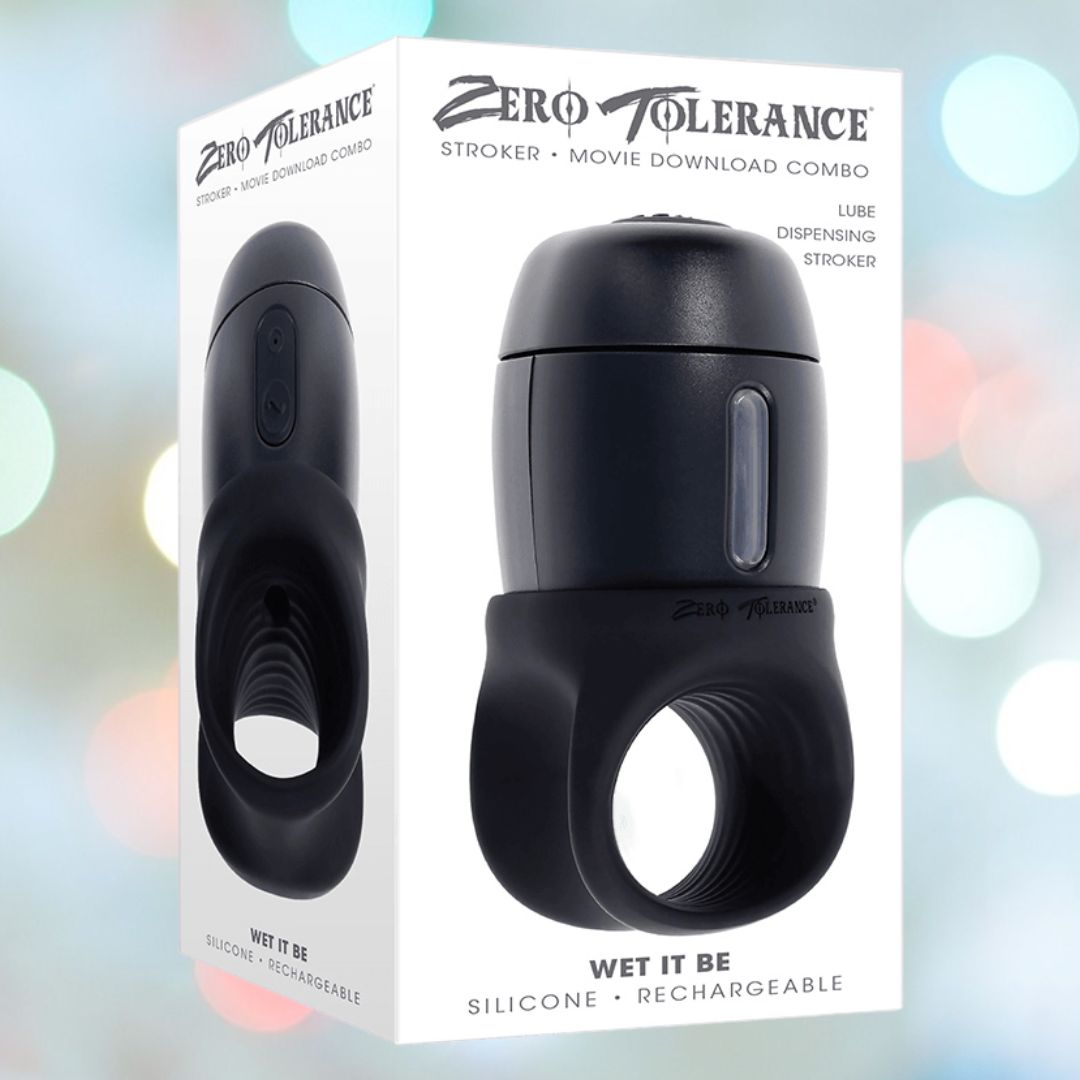 The packaging for the "Zero Tolerance Wet it Be Lube Dispenser Stroker" showcases a lube-dispensing stroker equipped with multi-speed vibrations. The box prominently features the product, accompanied by the phrase "Wet It Be," and emphasizes its silicone, rechargeable design, all set against a softly blurred light background.