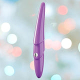 The Zumio S Spirotip Clitoral Stimulator by ZUMIO, INC is shown upright in light purple, featuring a metallic side button and cone-shaped design, against a soft pastel bokeh background, suggesting precise, pressure-sensitive stimulation.