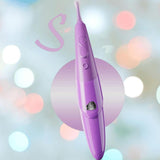 The Zumio S Spirotip Clitoral Stimulator - Light Purple by ZUMIO, INC stands upright against a blurred pastel background, its rounded tip and precise stimulation features highlighted by soft bokeh lights.