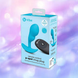 The B-Vibe Vibrating P-Spot Snug Plug RC Small by B-Vibe, a blue remote-controlled prostate stimulator, is featured in its packaging with product images and info, set against a soft purple and pink bokeh background.