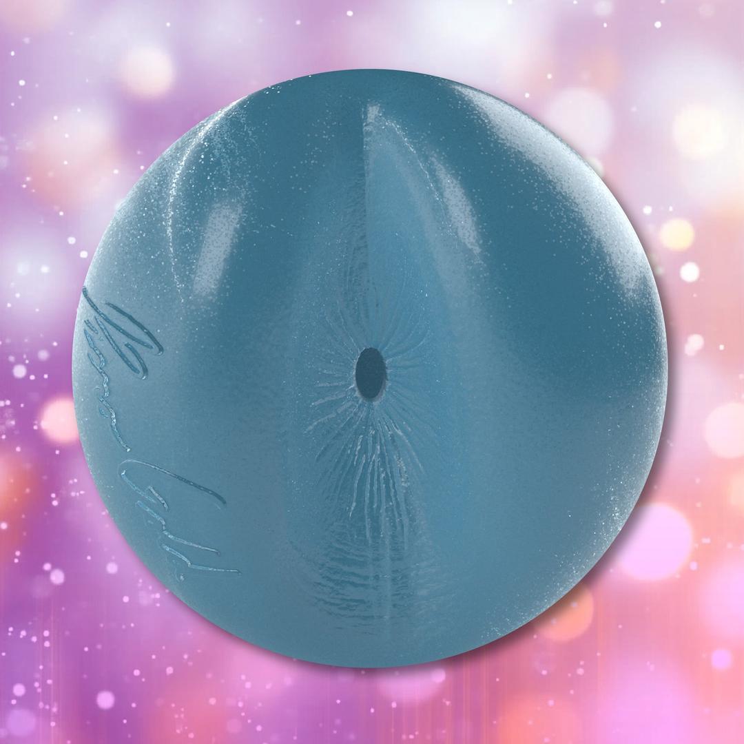A spherical blue Fleshjack Boys Reno Gold: Realistic Male Masturbator Cake Butt BIRTHDAY EDITION toy with a textured internal surface, a centered circular opening, and embossed cursive writing on the side.