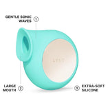 An aqua, rounded LELO SILA Air Suction Clit Massager with a large mouth opening on one side and a shiny metallic circular surface on the other. The image highlights features such as "Gentle Sonic Waves," "Large Mouth," "Extra-Soft Silicone," and its waterproof design for enhanced clitoral stimulation.