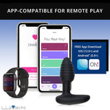 A smartwatch, smartphone, and a small black device are pictured. The phone screen displays an app interface with options like Music, Rhythm, Tap, and Touch. Text reads "APP-COMPATIBLE FOR REMOTE PLAY" and "FREE App Download iOS (12.0+) and Android (5.0+)." Also featured is the innovative OhMiBod Lumen Vibrating Butt Plug with LED Brilliance from OhMiBod.