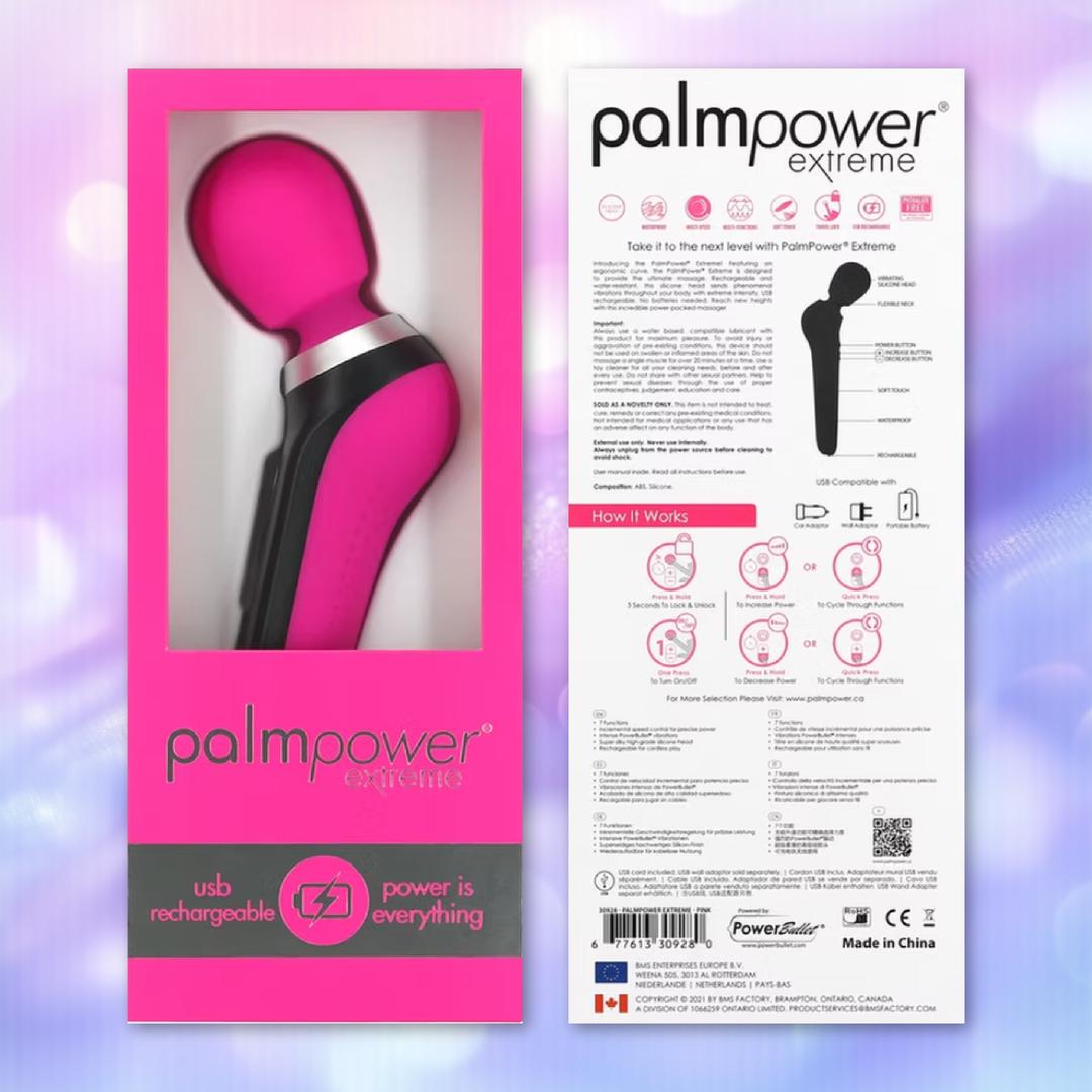 The PalmPower Extreme Wand Massager - Pink by BMS, a pink and black rechargeable silicone wand, sits in a pink "palmpower extreme" box with its packaging back showing instructions, features, and Powerbullet motor specs.