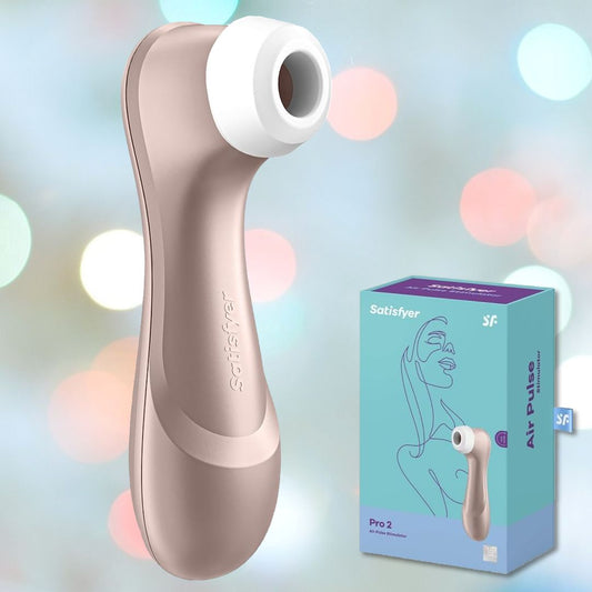 A Satisfyer Pro 2 Air Pulse Clitoral Stimulator, featuring a beige body and a white silicone tip, is showcased alongside its vibrant blue and purple packaging. The setting includes softly blurred lights in the background, contributing to a serene and relaxing atmosphere. 1080