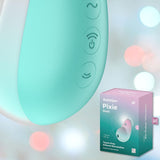 Close-up of a mint pink Satisfyer Pixie Dust Air-Pulse Clitoral Stimulator, featuring three control buttons, placed beside its matching pink and green packaging. The softly blurred lights in the background create a gentle ambiance, emphasizing its Air Pulse Technology.