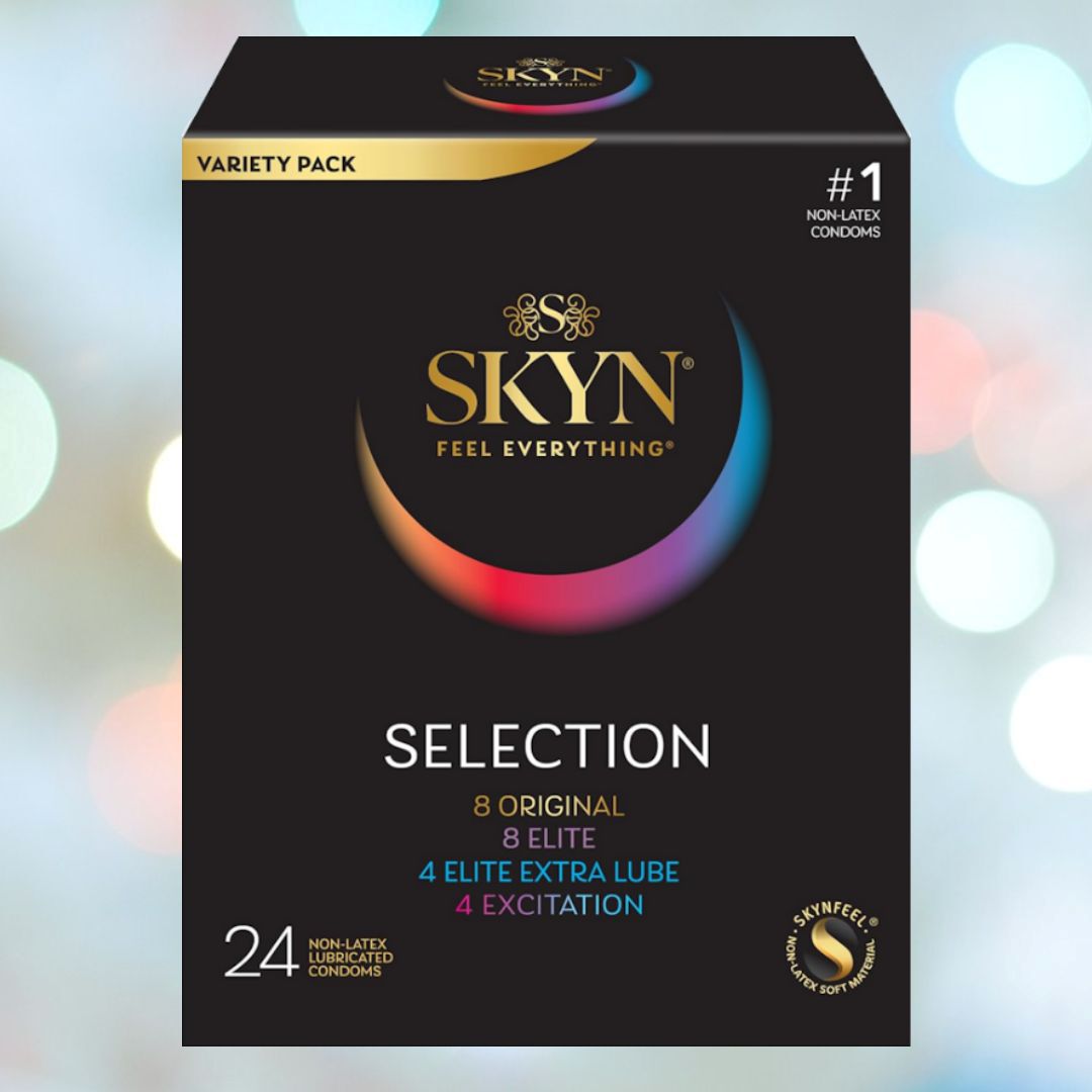 A box of LifeStyles SKYN Selection Condom Variety Pack (Latex-Free) from the brand LifeStyles includes 8 Original, 8 Elite, 4 Elite Extra Lube, and 4 Excitation condoms. The backdrop features soft, colorful bokeh lights.