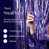 A hand showcases the Snail Vibe Dual-Motor Thrusting Vibrator in purple, featuring spiral designs against a glossy purple background. Text emphasizes its key features: 5 vibration modes, synchronized dual motors, and waterproof design for enhanced clitoral stimulation, brought to you by Snail Vibe.