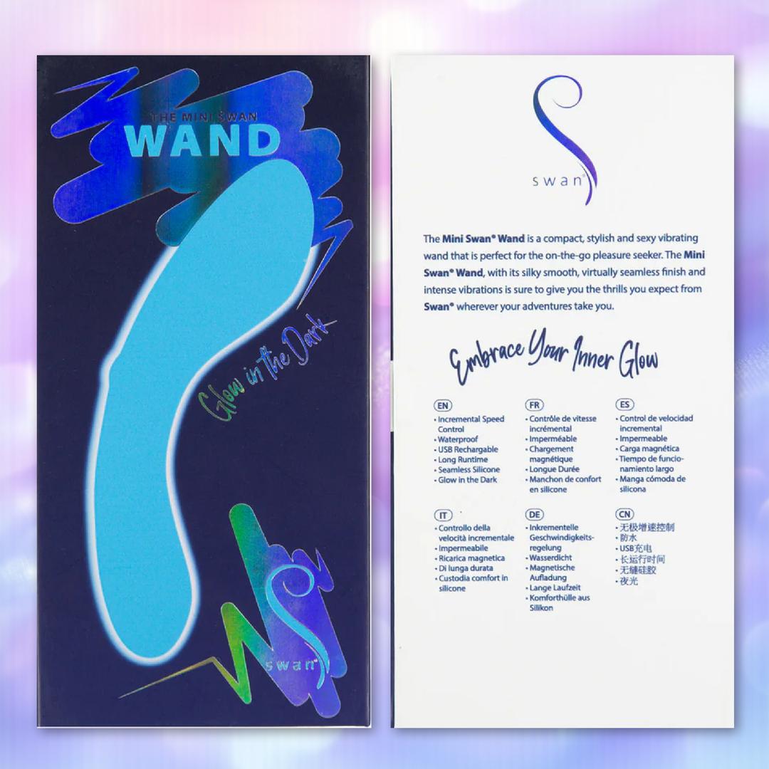 The BMS The Mini Swan Wand Glow in the Dark - Blue features glow-in-the-dark packaging with a wand outline and “Glow in the Dark” text on the left, travel-friendly features listed on the right, and the Swan logo plus "Embrace Your Inner Glow.”.
