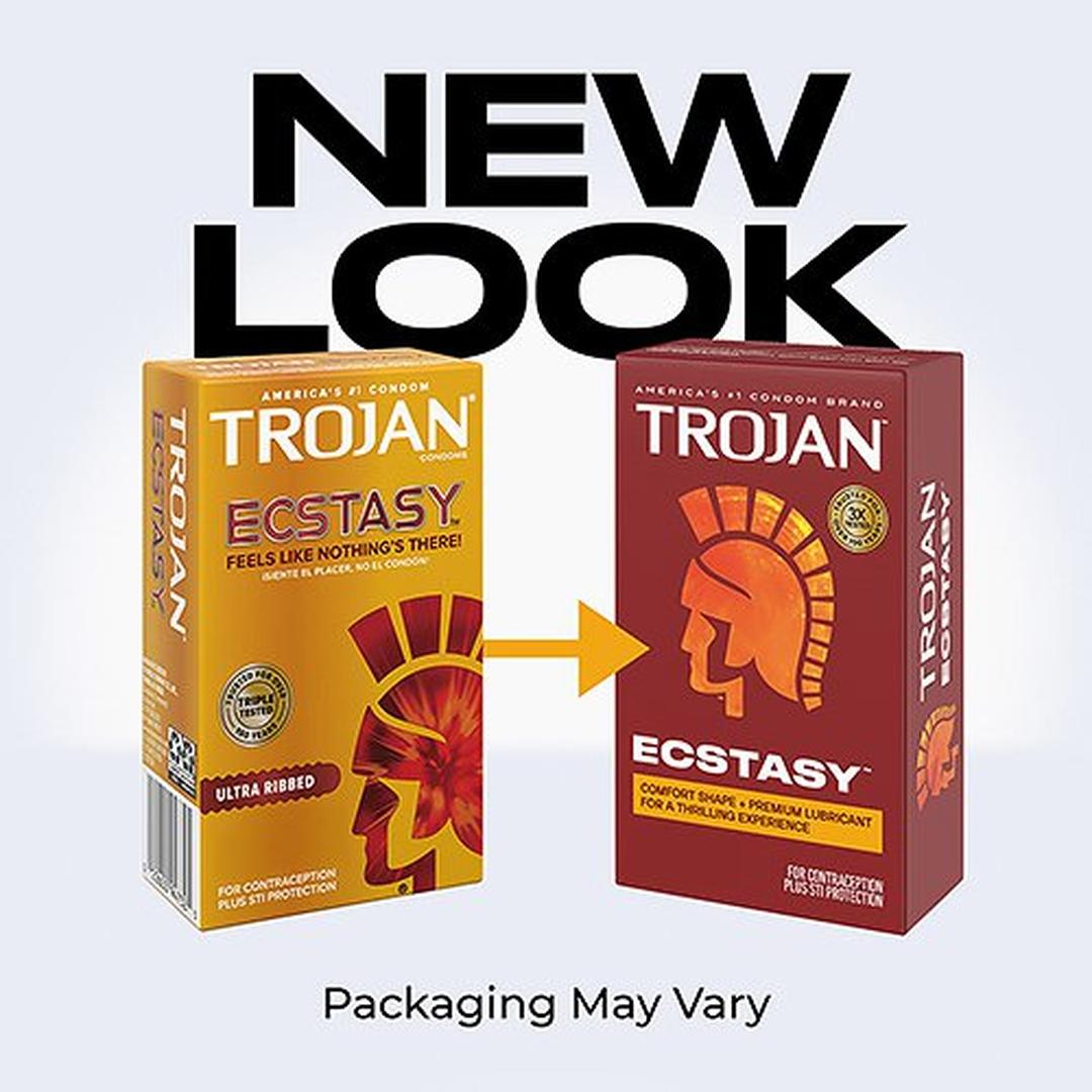 Two boxes of Trojan Ultra Ribbed Ecstasy Condoms by Trojan appear side by side with an arrow and "NEW LOOK" above them, showing the older yellow box on the left and the updated red packaging on the right.