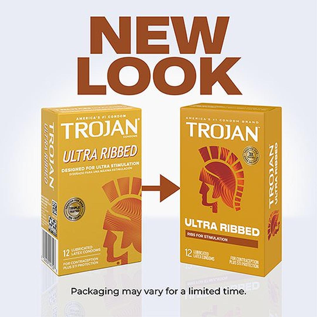 Two boxes of Trojan Ultra Ribbed Condoms are side by side, with an arrow from the old design on the left to the new lubricated latex condoms packaging on the right. Text above says "NEW LOOK." Brand: Trojan.