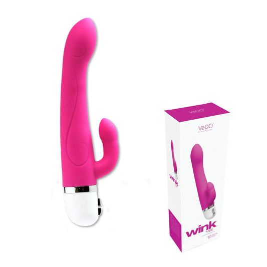 Image of the VeDO Wink Rabbit Vibe - Hot Pink, a dual-motored vibrator with a curved design and a white base. The toy features a smaller extension near its base, perfect for G-Spot and clitoris stimulation. Shown next to its packaging—a sleek white box marked with the brand name "VeDO" and the model name "Wink"—it offers twelve gratifying modes. 1080