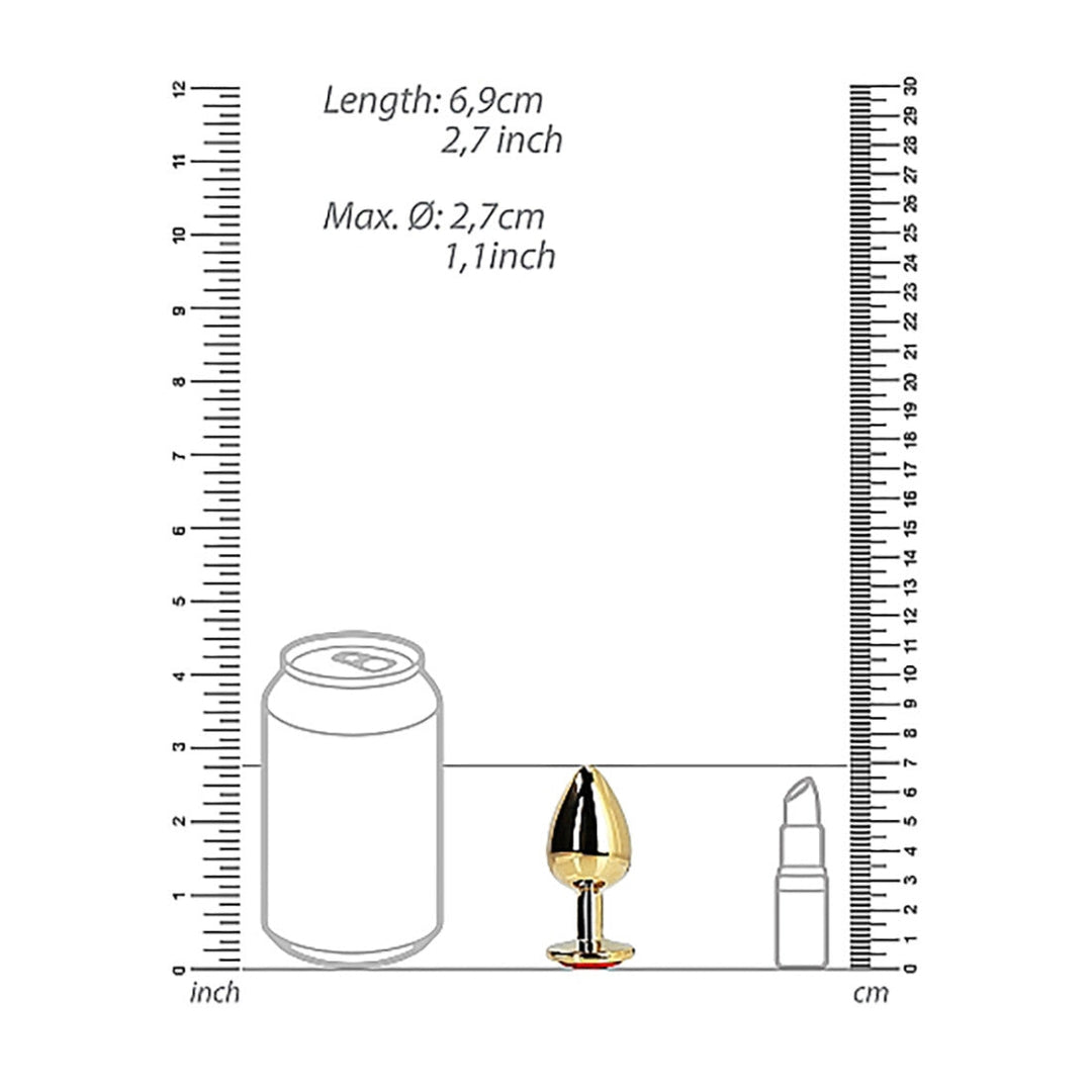 An image illustrating a size comparison of three objects: a soda can, the Shots Ouch! Heart Gem Butt Plug Small - Gold/Ruby Red by Shots, and a lipstick. Each item is positioned between two rulers displaying measurements in both inches and centimeters for reference.