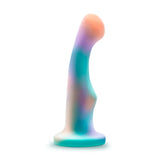 The Avant Opal Dreams Dildo - Aqua offers G-spot stimulation with its vibrant and ergonomic design featuring a blend of pastel blue, purple, and peach hues against a clean white background. Crafted from Puria silicone, it includes a wide base for added stability.