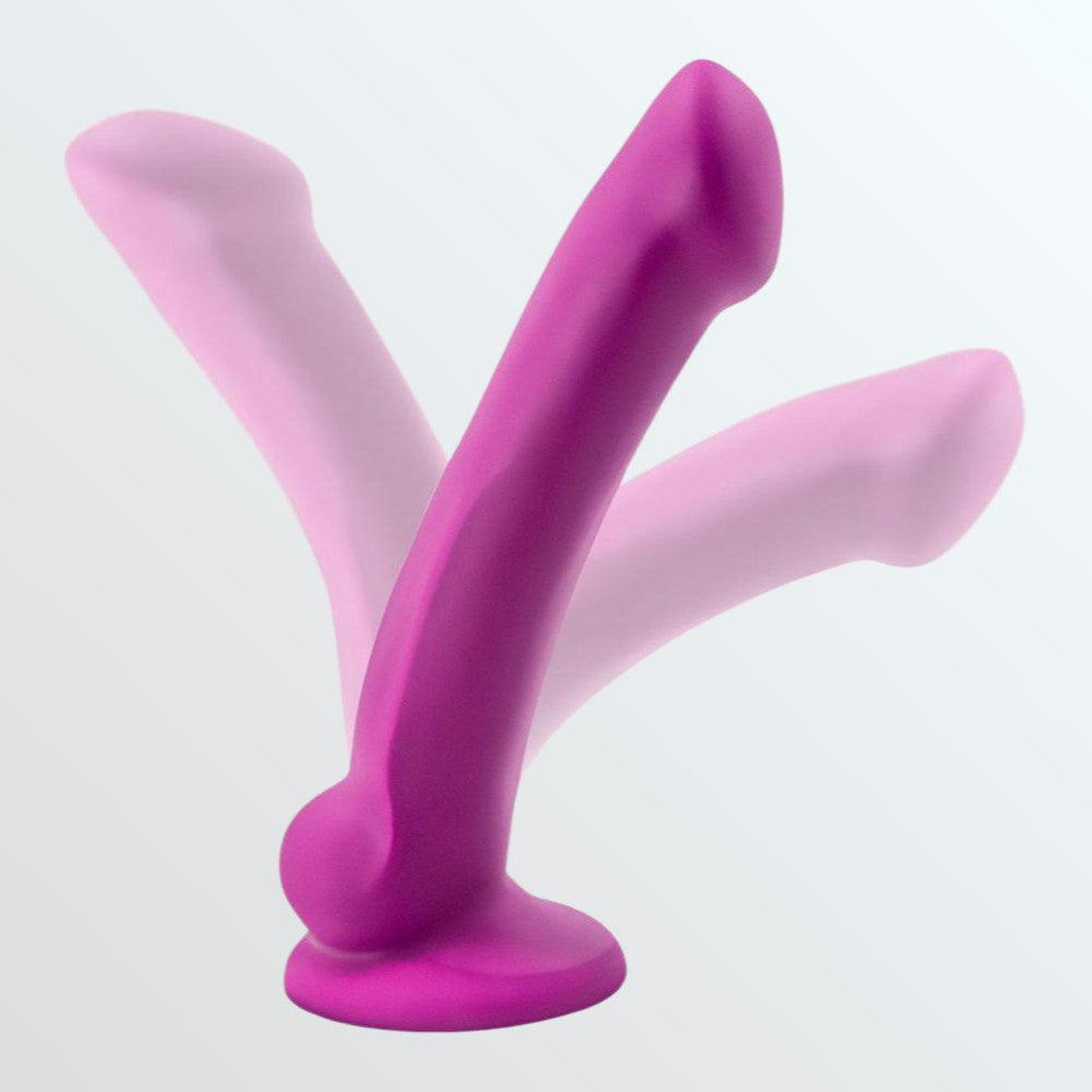 A violet, artisanal toy made by Avant and crafted from non-porous silicone is displayed in three positions to demonstrate its flexibility. The hand-sculpted Avant D9 Ergo MINI 6.5" features a rounded base and a tapered, curved shaft set against a pale gray background.